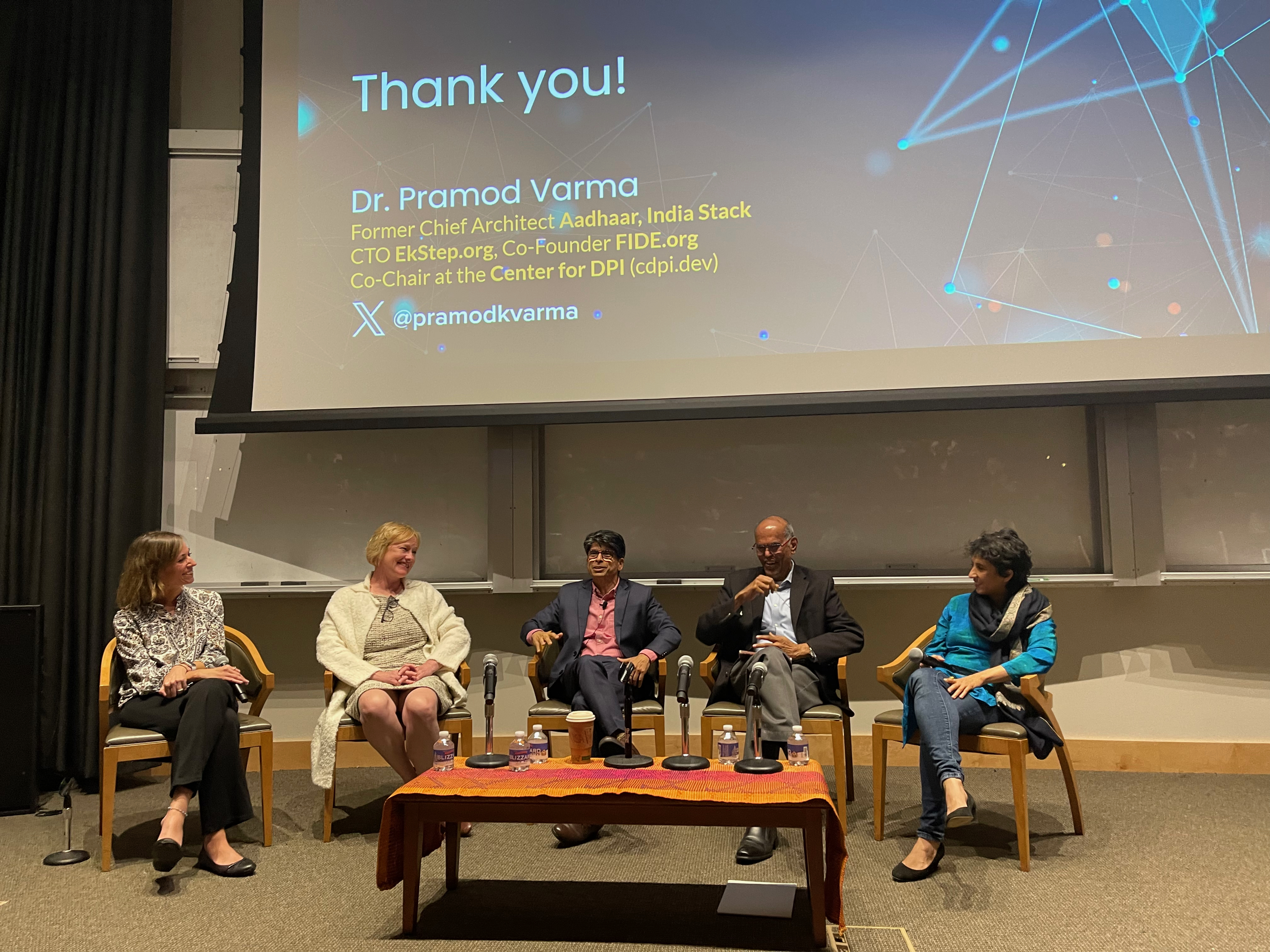 "Charity Troyer Moore, Alix Peterson Zwane, Pramod Varma, Duvvuri Subbarao, and Rohini Pande discuss Pramod's insights during a panel session"