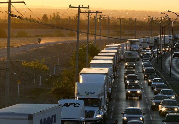 Feature image in the Economist piece titled "How Chinese goods dodge American tariffs" showing vehicles in queue on a highway